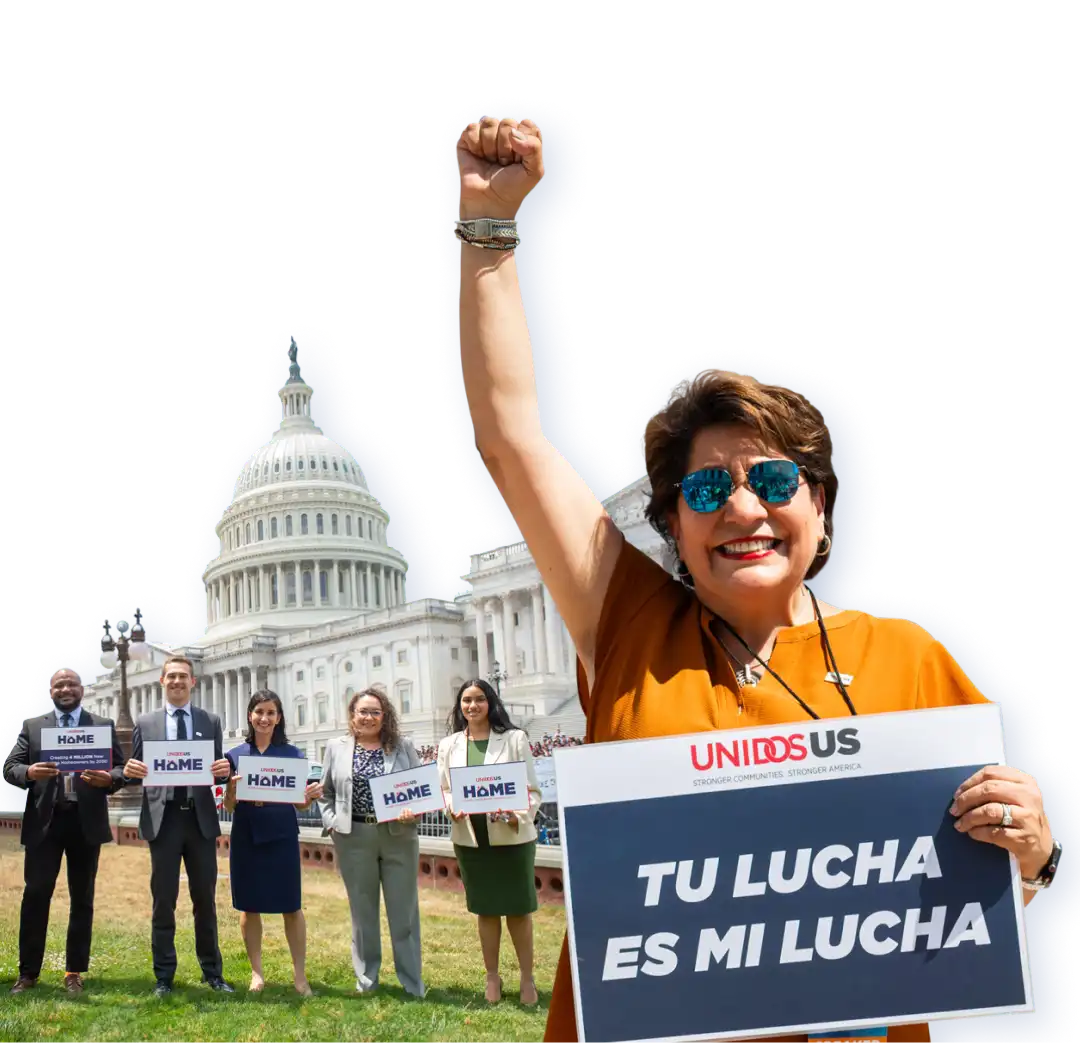 UnidosUS staff outside Capitol Hill launching our 'Home Ownership Means Equity' campaign with UnidosUS President Janet Murguía holding a sign that says 'Tu lucha es mi lucha' (Your fight is my fight).